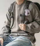 Mini Pouch | Block - A light purple mini pouch clipped to a backpack strap with a carabiner, worn by a person in a sweater.