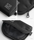 Mini Pouch | Half-Pocket - Close-ups of a black fabric pouch showing the branded label, zipper pull, and soft interior lining.
