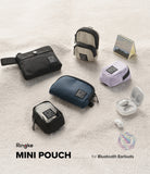 Mini Pouch | Half-Pocket - Assorted small fabric pouches in various colors and shapes arranged on a textured white surface.