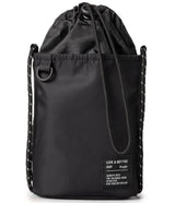 Mini Cross Bag | Bucket Bag - Black drawstring bucket bag with a white-speckled rope strap and a branded fabric patch.