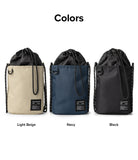 Mini Cross Bag | Bucket Bag - Three drawstring bucket bags in light beige, navy, and black with branded labels.