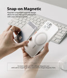 Card Holder | Magnetic Slot - Hands holding a clear phone case and a magnetic card holder above a computer keyboard.