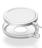 MagSafe Charger Case | Slim - A white circular magnetic charger hovering above a transparent, slim protective silicone case.