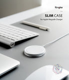 MagSafe Charger Case | Slim - A clear protective case on an Apple MagSafe charger resting on a grey desk with a keyboard.