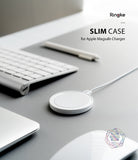 MagSafe Charger Case | Slim - White MagSafe charger in a slim protective case on a grey desk with a keyboard and pen.