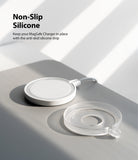 MagSafe Charger Case | Slim - A white MagSafe charger next to a clear, circular silicone anti-slip case on a gray surface.