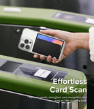 Card Holder | Magnetic Side Slot - Hand holding a phone with a magnetic card holder over a subway turnstile scanner.