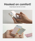 Card Holder | Magnetic Side Slot - Hands attaching and using a magnetic card holder on the back of a clear smartphone case.