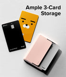 Card Holder | Magnetic Side Slot - A light pink magnetic card holder containing cards, next to a black card and a yellow Ryan character card.