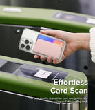 Card Holder | Magnetic Side Slot - Hand holding a phone with a pink magnetic card holder over a subway turnstile scanner.