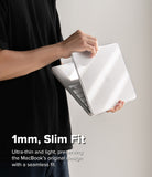 MacBook Neo | Slim - A person in a black shirt holds a slim white laptop closed, demonstrating its thin profile. White text at the bottom reads '1mm, Slim Fit' with additional descriptive copy about the ultra-thin and light design.