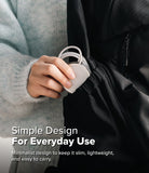 MagSafe (2024) Charger Case | Slim - Matte Clear - Hand placing a slim, matte clear MagSafe charger into a black backpack.