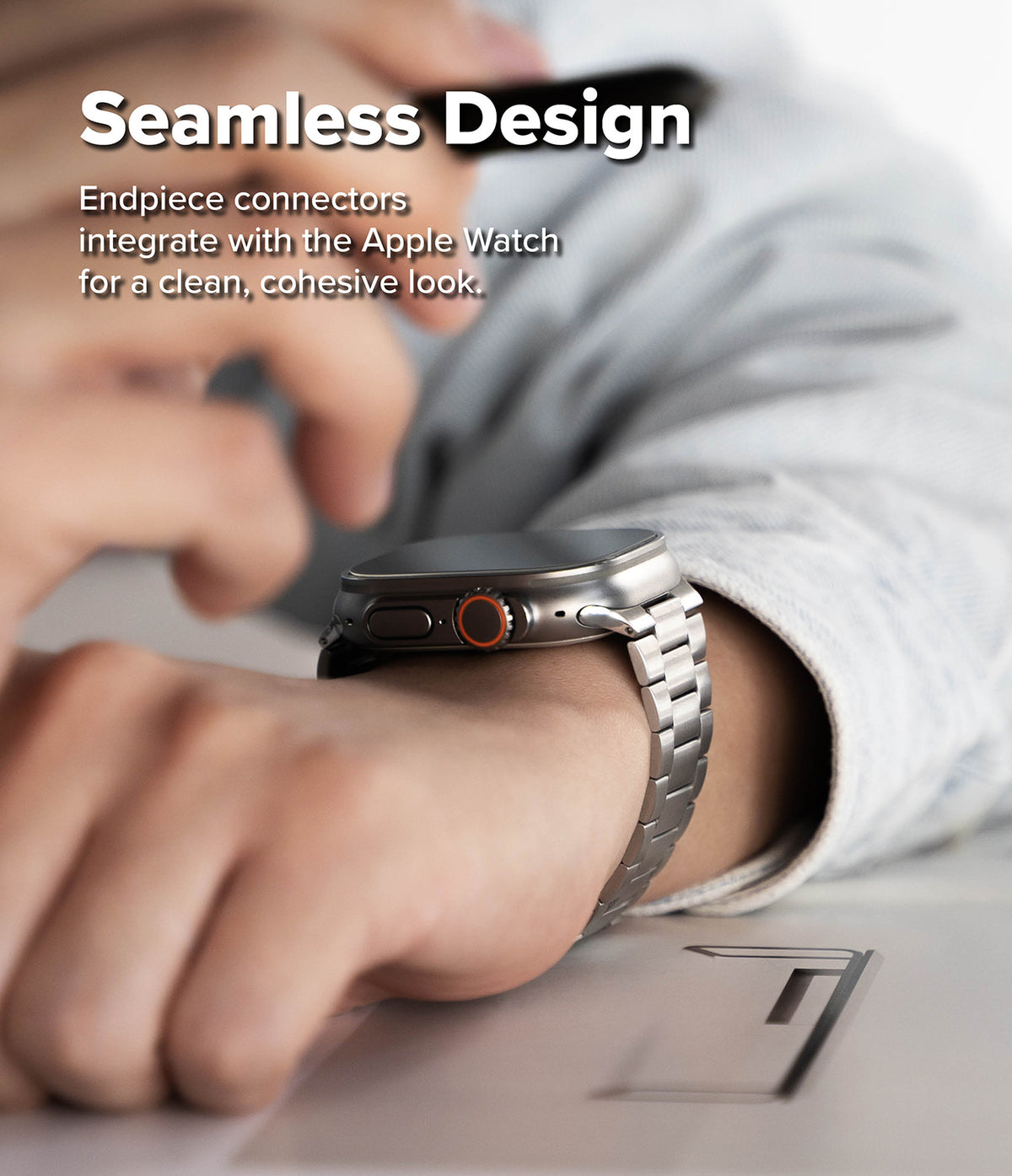 Apple Watch 49·46·45·44·42 mm | Metal One Air - Close-up of a metal link watch band seamlessly attached to an Apple Watch.