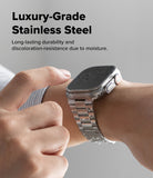 Apple Watch 49·46·45·44·42 mm | Metal One Air - Stainless steel watch band on wrist with water droplets on the screen.