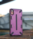 iPhone XR Case | Dual-X [DX] - Metallic purple rugged phone case with black accents standing on a brick surface.