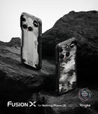 Nothing Phone (3) Case | Fusion-X - Two Nothing Phone (3) devices in rugged Fusion-X cases resting on dark, textured volcanic rock.