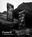 Nothing Phone (3a) Pro Case | Fusion-X - Two black rugged phone cases standing on dark, textured volcanic rock.