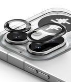 Nothing Phone (4a) Pro | Camera Glass (2P) - Two black protective glass lens covers hovering above a smartphone camera.