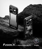 Nothing Phone (4a) Pro Case | Fusion-X - Two rugged black phone cases displayed on dark, textured volcanic rock.