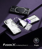 Nothing Phone (1) Case | Fusion-X - Three clear protective cases displayed with Nothing Phone (1) devices on a purple surface.