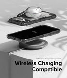 Nothing Phone (2) Case | Fusion-X - A Nothing Phone (2) in a clear case wirelessly charging on a circular pad.