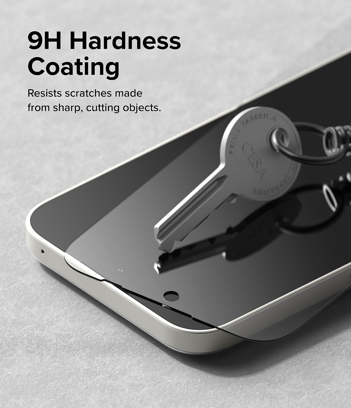 Nothing Phone (2a) / (2a) Plus Screen Protector | Glass - Nothing Phone (2a) / (2a) Plus Screen Protector - A metal key rests on a smartphone screen protector, demonstrating 9H hardness.