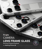 Nothing Phone (3) | Camera Glass - Stacked white smartphones with black camera lens protectors being applied.