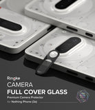 Nothing Phone (3a) | Camera Glass - A black camera lens protector being applied to a white Nothing Phone (3a) handset.