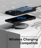 OnePlus 12R Case | Fusion-X - A smartphone in a black protective case charging wirelessly on a circular pad.