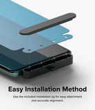 OnePlus 12 Screen Protector | Dual Easy Film [2 Pack] - OnePlus 12 Screen Protector - Installation jig aligning a blue screen protector film onto a smartphone screen.