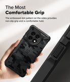 OnePlus 13R Case | Fusion-X - Hand holding a black camo phone case with textured side grips and a circular camera cutout.