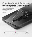 OnePlus 13R Screen Protector | Tempered Glass - A metal key resting on a 9H tempered glass screen protector applied to a smartphone.