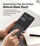OnePlus 13R Screen Protector | Tempered Glass - Hands holding a phone with a tempered glass screen protector while typing on the keyboard.