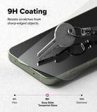 OnePlus 13S Screen Protector | Easy Slide Tempered Glass - A metal key resting on a smartphone screen, demonstrating 9H scratch-resistant glass.