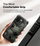 OnePlus 13S Case | Fusion-X - Hand holding a camo-patterned phone case with textured, non-slip dotted side grips.