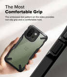 OnePlus 13S Case | Fusion-X - Hand holding a phone with a black protective case featuring a textured, non-slip side grip.