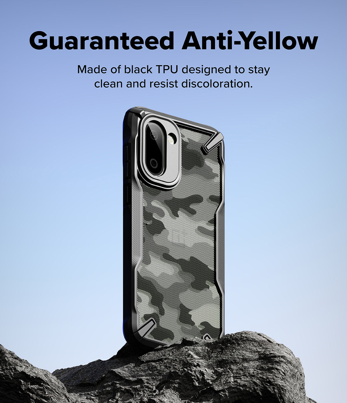 OnePlus 15R Case | Fusion-X - Black camouflage phone case standing on a rock against a light blue sky background.