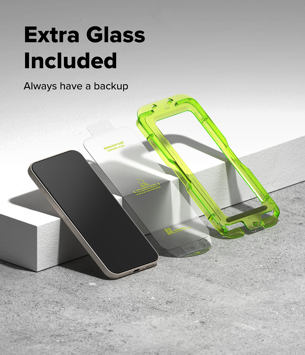 [Bundle] OnePlus 15 | Fusion-X - OnePlus 15 | Fusion-X - A smartphone, a screen protector, and a bright green installation frame on a concrete surface.