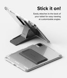 Outstanding | Tablet Stand - A gray foldable tablet stand attached to the back of a clear tablet case in upright and flat positions.