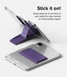 Outstanding | Tablet Stand - A purple foldable tablet stand shown attached to a clear tablet case in both open and closed positions.
