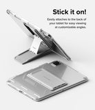 Outstanding | Tablet Stand - A silver foldable tablet stand attached to a clear tablet case, shown both open and closed.
