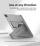 Outstanding | Tablet Stand - A silver tablet stand attached to the back of a tablet, propping it up on a white desk.