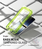 Poco F7 Screen Protector | Easy Slide Tempered Glass - Poco F7 Screen Protector - Bright green installation tray hovering over a smartphone screen protector on a white surface.