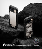 Google Pixel 10 Pro / 10 Case | Fusion-X - Two rugged phone cases on black rock, one clear and one with camo pattern.