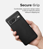 Google Pixel 7 Case | Onyx - Hand holding a black textured phone case with a secure grip design and camera cutout.