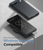 Google Pixel 7a Case | Fusion Matte - Matte black phone case on a Pixel 7a, one unit charging wirelessly on a pad.