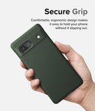 Google Pixel 7a Case | Onyx - A hand holding a dark green textured phone case with a camera bar cutout against a white background.