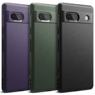 Google Pixel 7a Case | Onyx - Three textured phone cases in purple, green, and black standing side-by-side.
