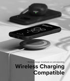 Google Pixel 8a Case | Onyx - Black phone in Onyx case hovering over a wireless charging pad on a white surface.