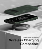 Google Pixel 8 Pro Case | Onyx - Dark green phone case on a wireless charging pad with another case in the background.